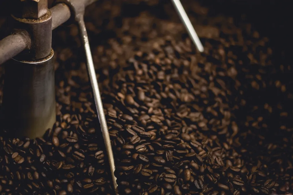 Coffee beans turning in the cooling tray of a roaster